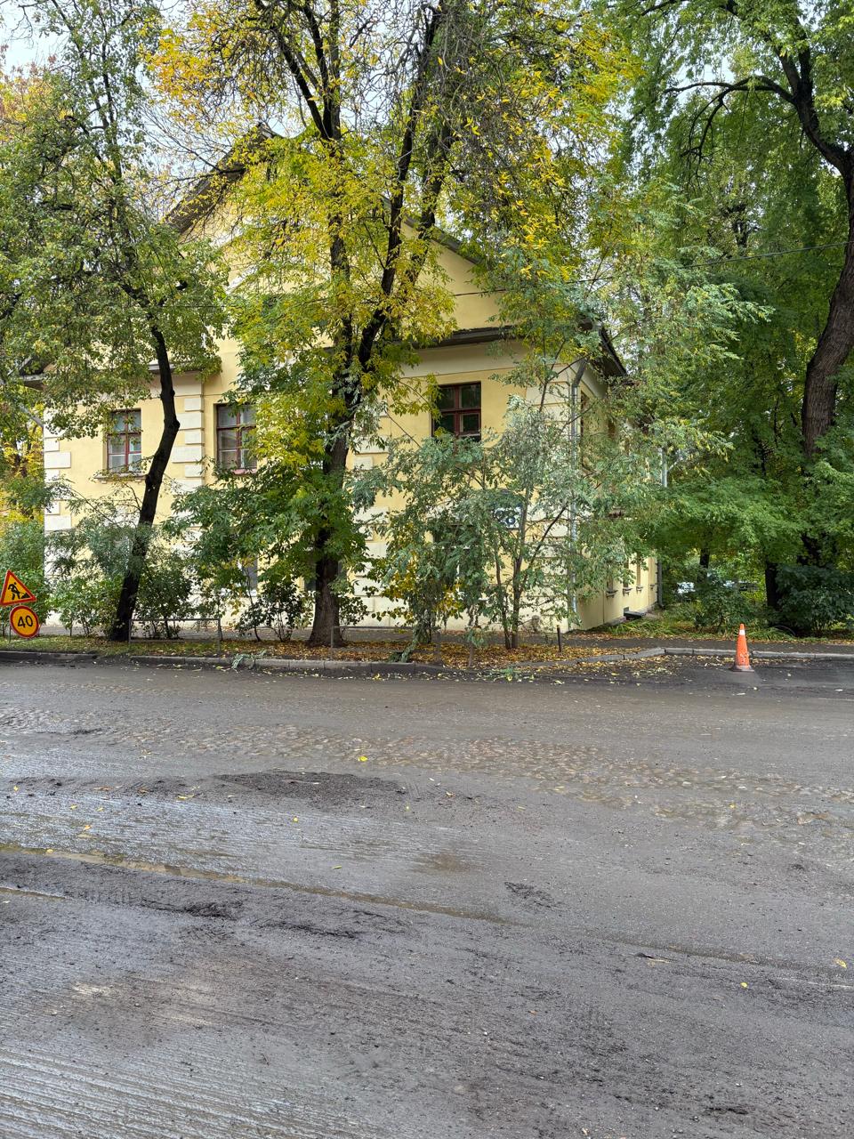 On Kommunisticheskaya Street, asphalt removed to reveal old cobblestone
