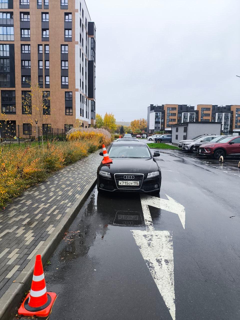 Cars parked near children's playground marked in Levada residential complex