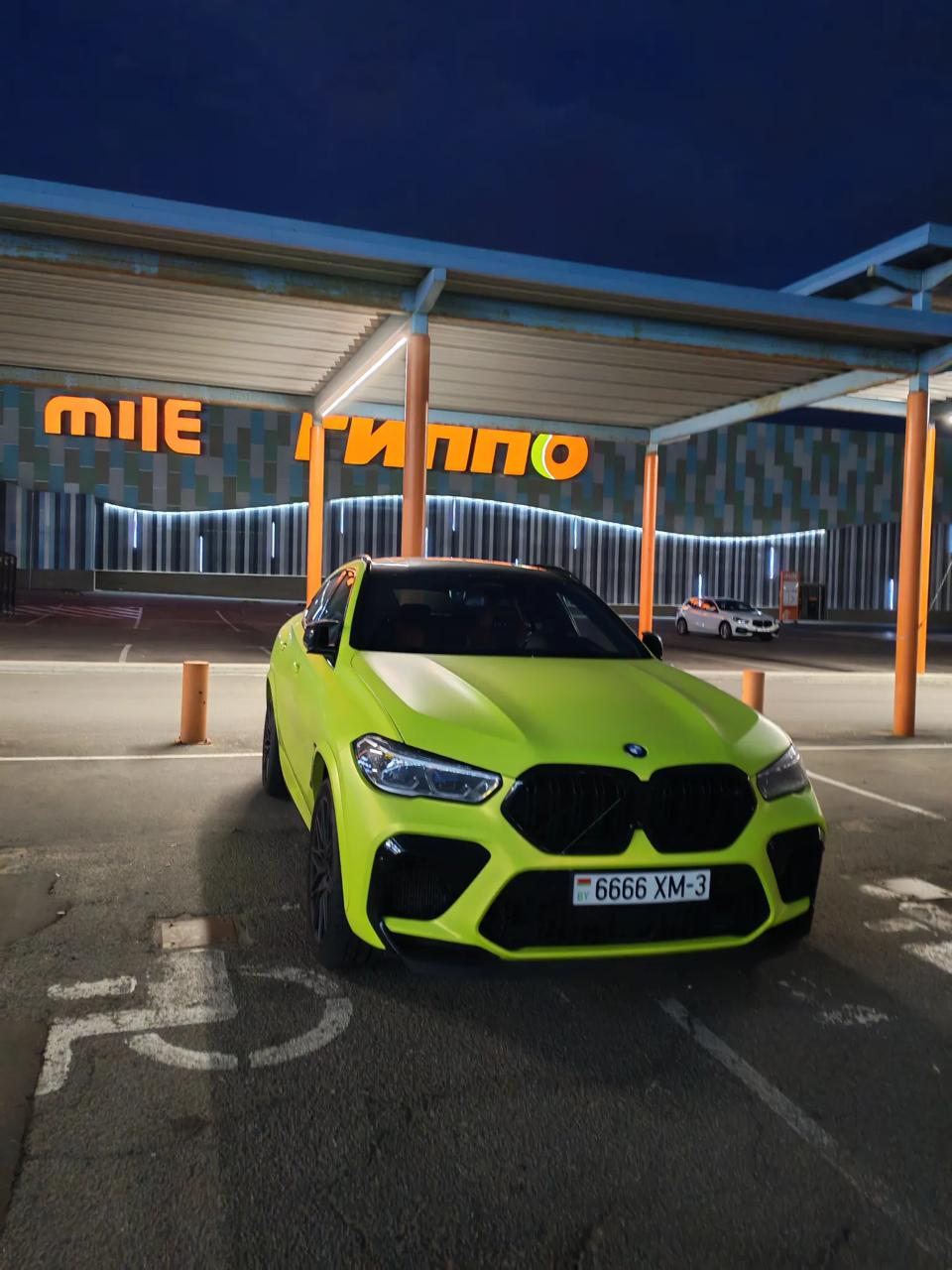 BMW driver takes two disabled parking spots at 'Expobel' market in Minsk
