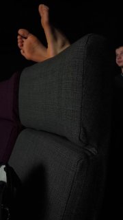 In a Galileo cinema, a viewer put bare feet on the seat next to a girl