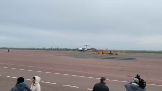 Three planes with evacuated residents from frontline Alerski landed in Gomel