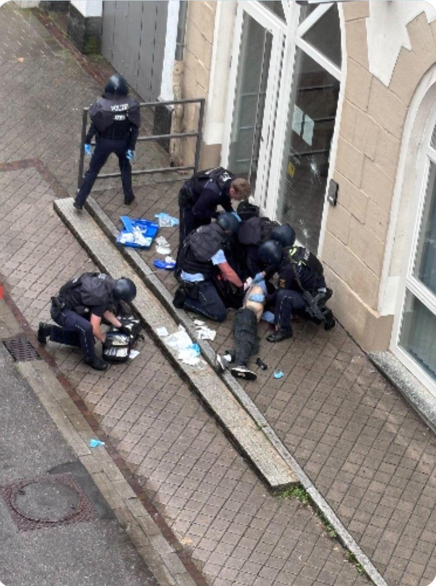 Police shoot dead armed Afghan man in German town hall