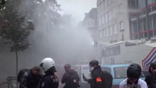 In Brussels, police used water cannons and tear gas to disperse youth riots
