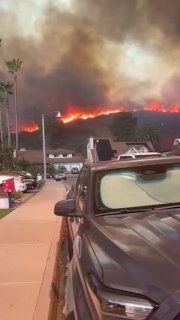 California wildfires reach residential areas, spread to Los Angeles suburbs