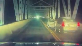 American jumps off 30-meter bridge into lake to escape police chase — NBC News
