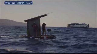 Two Australians cross dangerous strait on a toilet-turned-raft to save money