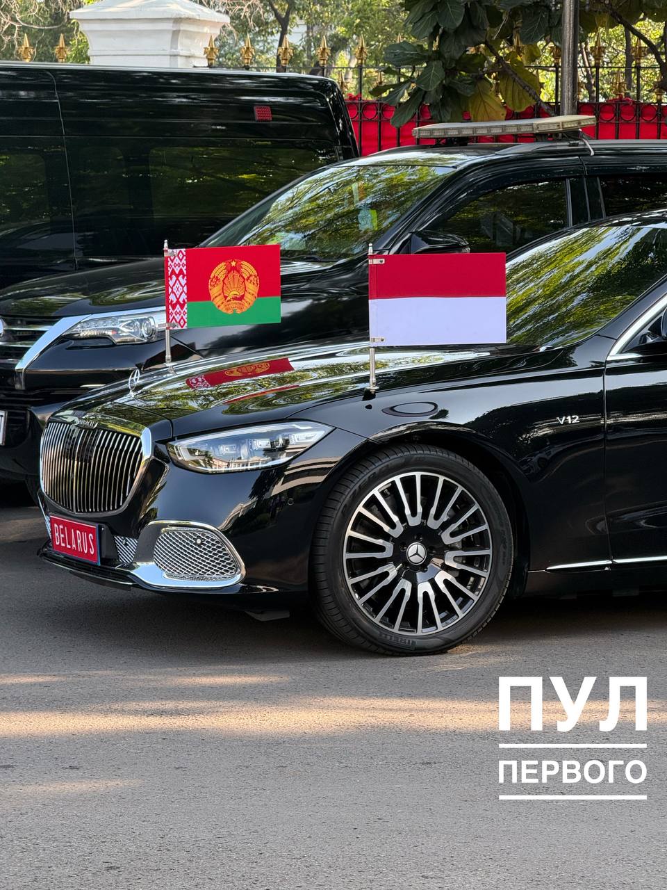 Belarusian flag on the hood and license plate 'Belarus' in Jakarta
