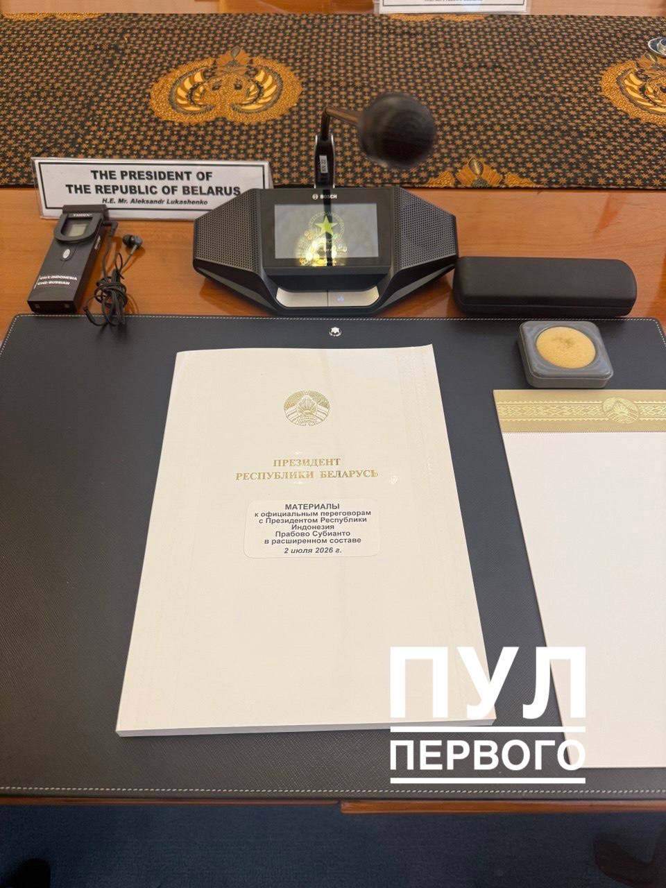 Indonesian protocol peculiarity: president's desk includes snacks, drinks, and a separate microphone